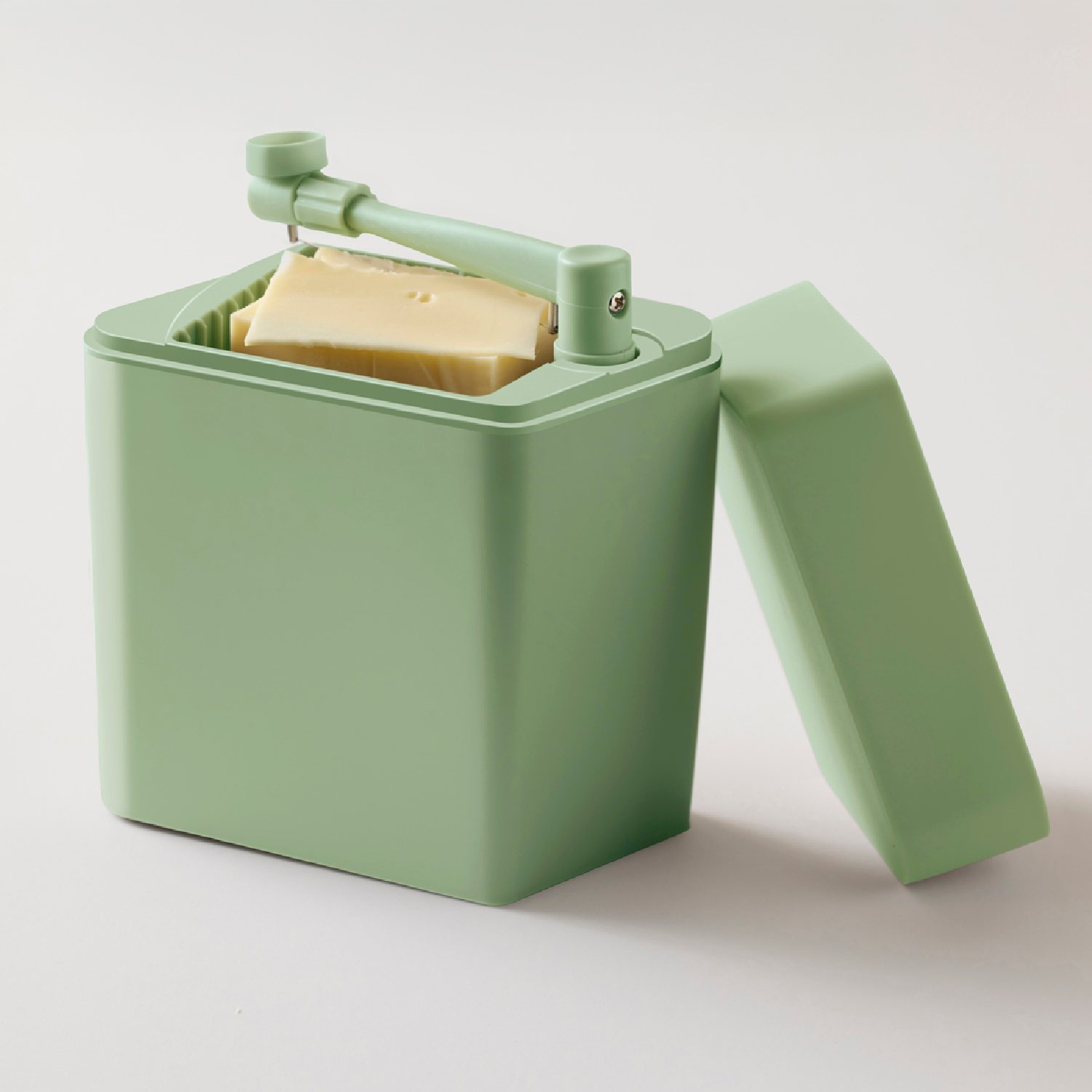 Dezute suriui rosti zalia atidaryta Sūrio dėžutė su pjaustykle Rosti žalia, pagrindinė